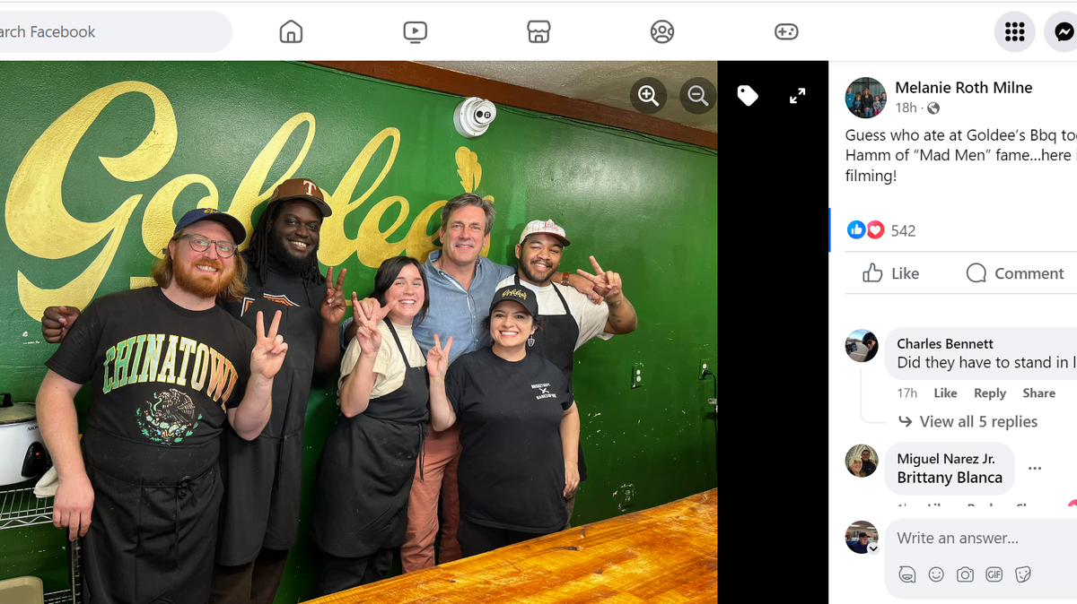 Actor Jon Hamm poses for a photo with staff at Goldee’s Barbecue in Fort Worth.