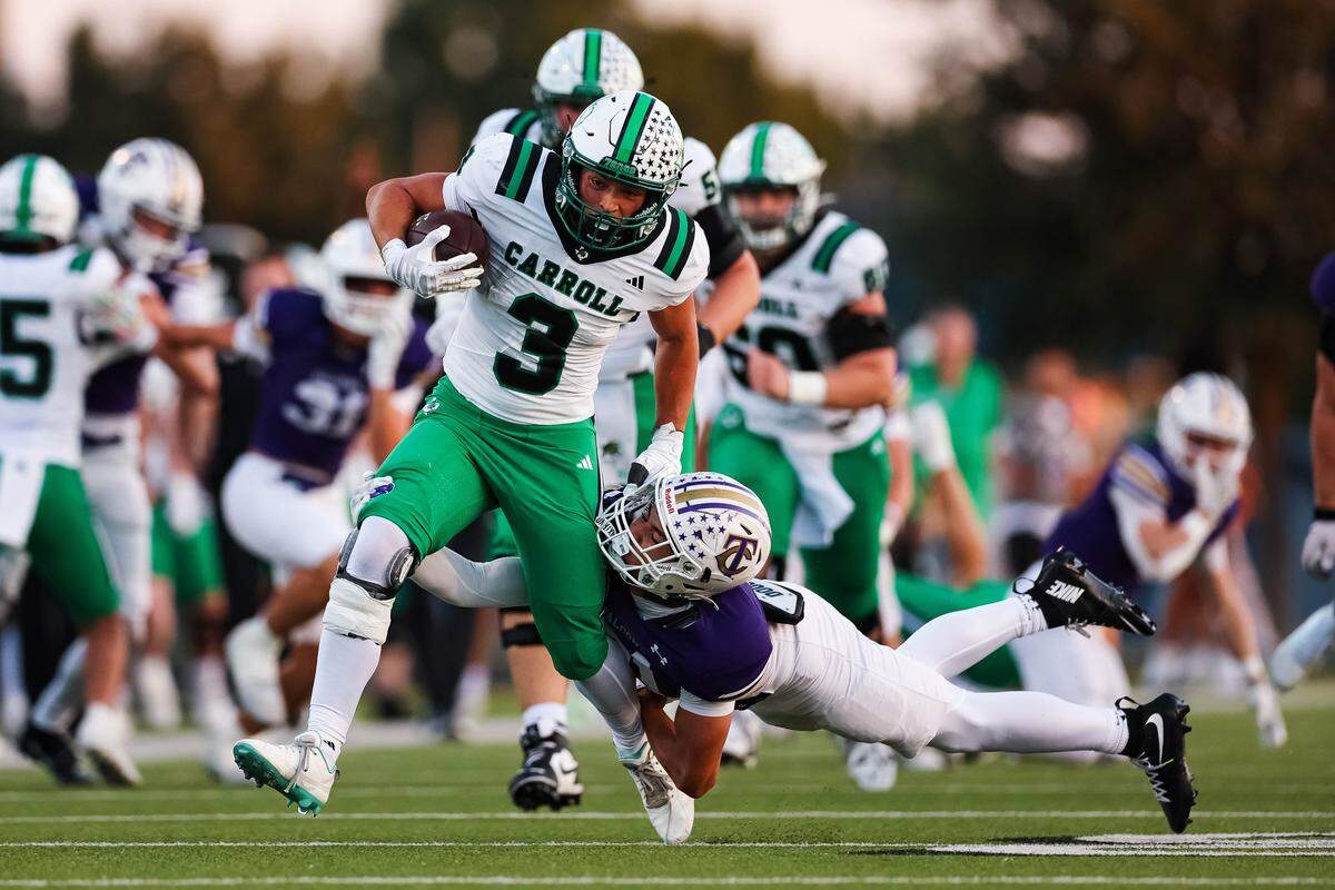 Southlake Carroll running back Davis Penn runs through a Keller Timber Creek defender Sept. 25 at Keller ISD Stadium.