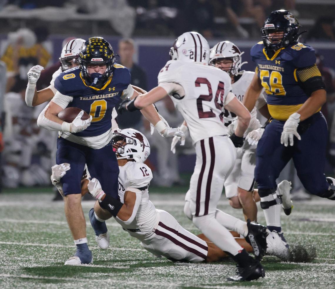Stephenville running back Sawyer Wilkerson (0) gains some tough yards up the middle during a UIL District 4-4A D1 football game at Tarleton State Memorial Stadium in Stephenville, Texas, Friday, Nov. 01, 2024.
