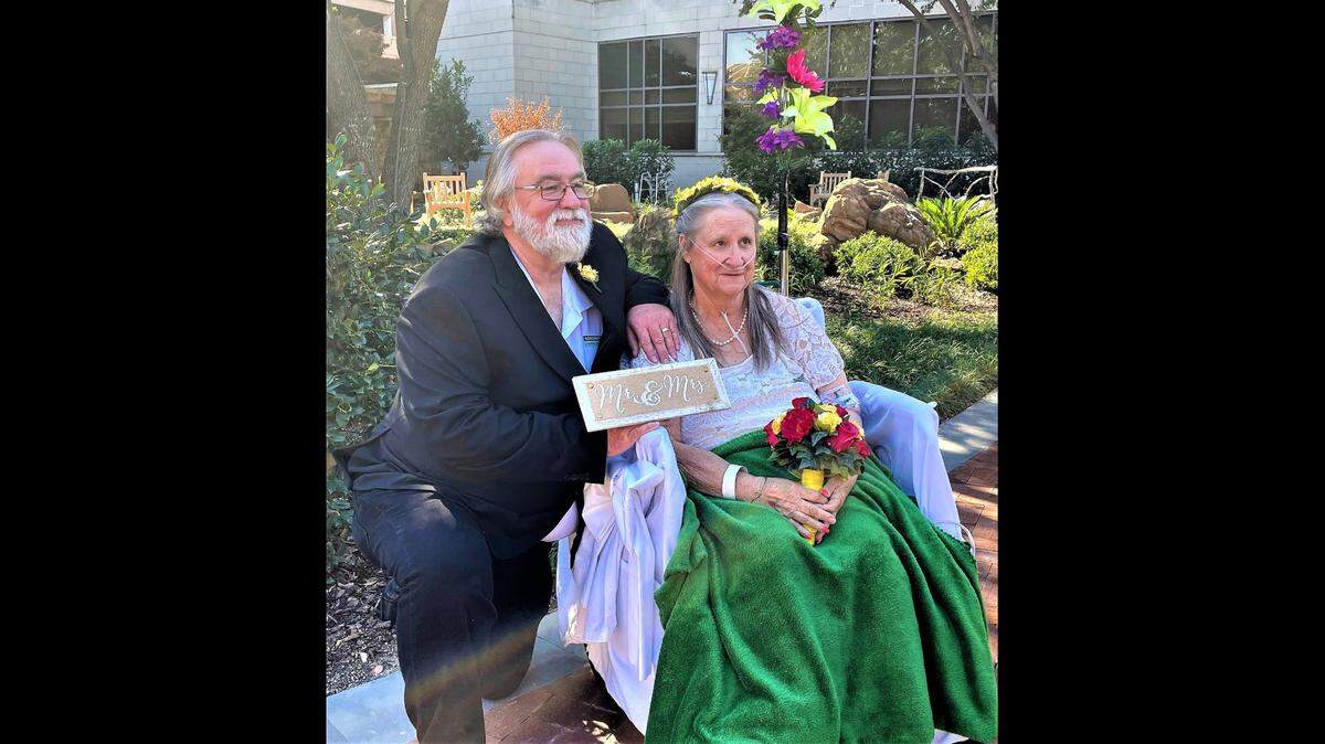 Eric and Donna Wood pictured on their wedding day outside Texas Health Harris Methodist Hospital Fort Worth on Nov. 6.