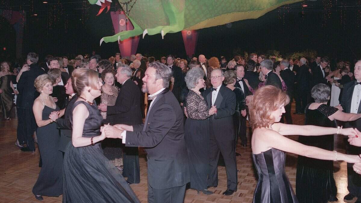 Jan. 9, 1999: Jewel Charity Ball attendees dance under the Emerald Dragon at the Amon Carter Jr. Exhibits Hall. The Emerald Dragon was later sold to a high school for a mascot.