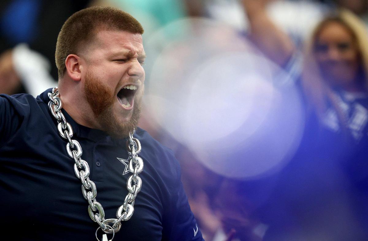 A Dallas Cowboys fan cheers during the second half against the Washington Commanders on Sunday, October 2, 2022.
