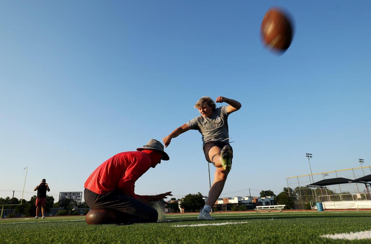Southlake Carroll kicker Kyle Lemmermann works out with former TCU kicker Jaden Oberkromworkout on Monday, July 24, 2023, at Paschal High School in Fort Worth. Lemmermann is a TCU commit and Chris Sailer’s No. 1 ranked kicker in the nation.
