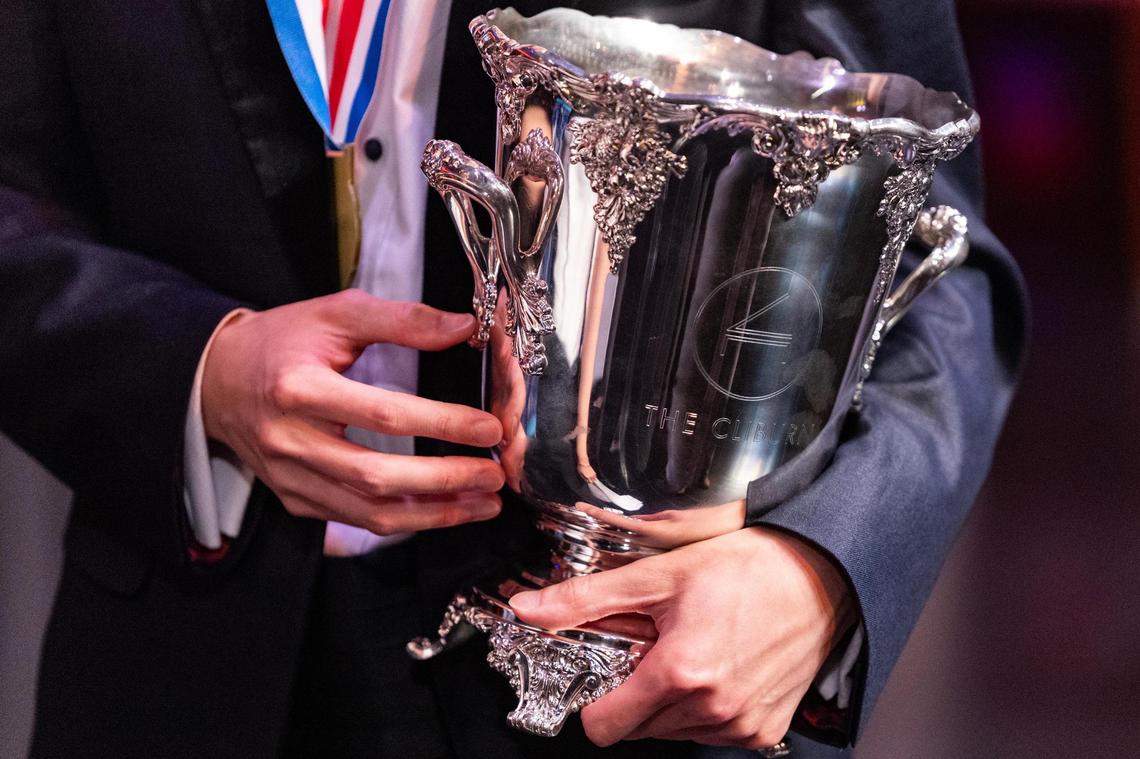 Aristo Sham of Hong Kong, China holds the Van Cliburn Winners Cup during the Van Cliburn International Piano Competition Awards Ceremony at Bass Performance Hall in Fort Worth on Saturday, June 7, 2025.