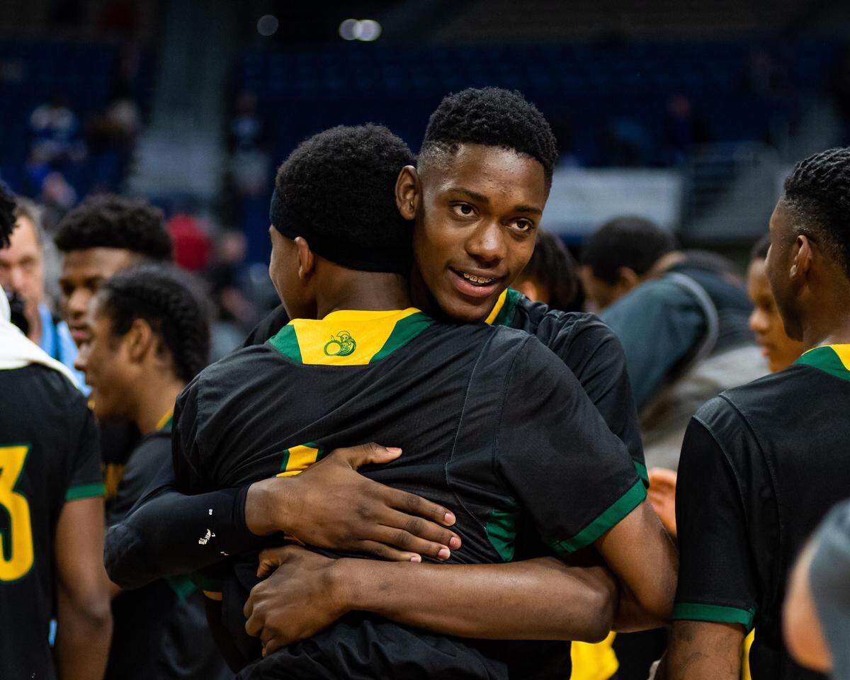 Dallas Madison celebrates the 3A state title over Brock, Saturday March 9, 2019.