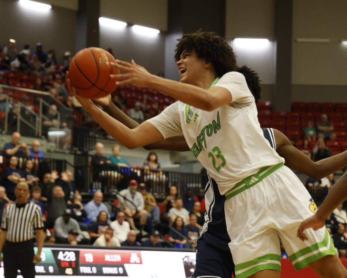 Eaton forward Wesley Zenon (23) is fouled by Allen’s Cadarian Urune-Williams (0) on the way to the net during a UIL Class 6A Division I boys regional semifinal basketball game at Coppell High School in Coppell, Texas, Tuesday, March 3, 2026.