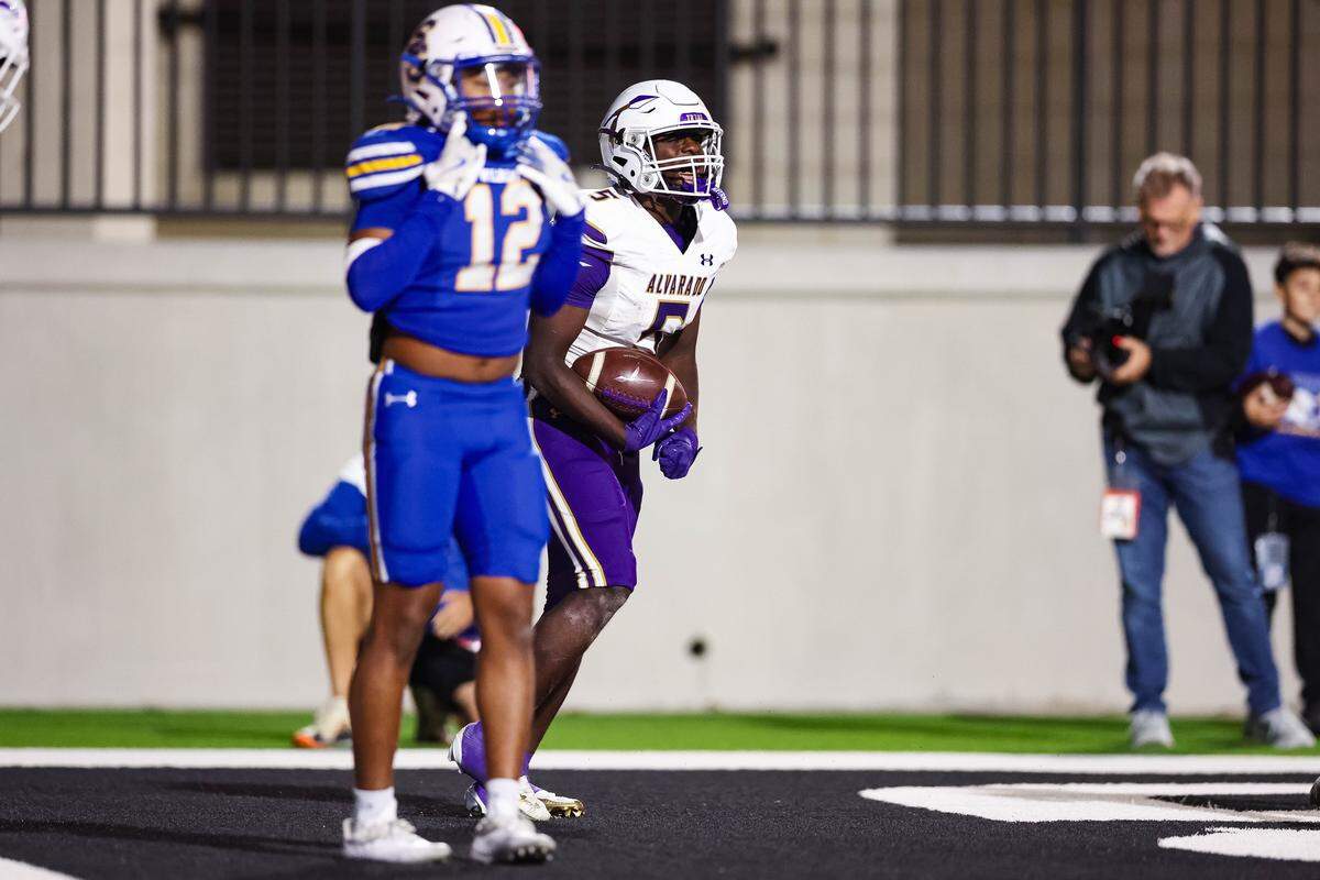 Alvarado running back Demarcus Belton screams in celebration after scoring a touchdown in a Class 4A Division I area playoff game against Sulphur Springs on Friday, Nov. 21, 2025, at Children’s Health Stadium in Prosper, Texas.