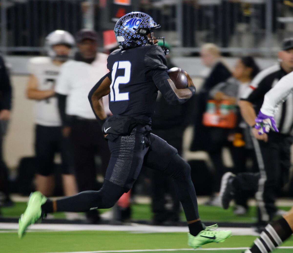 North Crowley quarterback Chris Jimerson (12) streaks down the sidelines for a huge gain during a UIL Class 6A D1 Area Round football playoff football game at Crowley ISD Multi-Purpose Stadium in Fort Worth, Texas, Friday, Nov. 22, 2024.