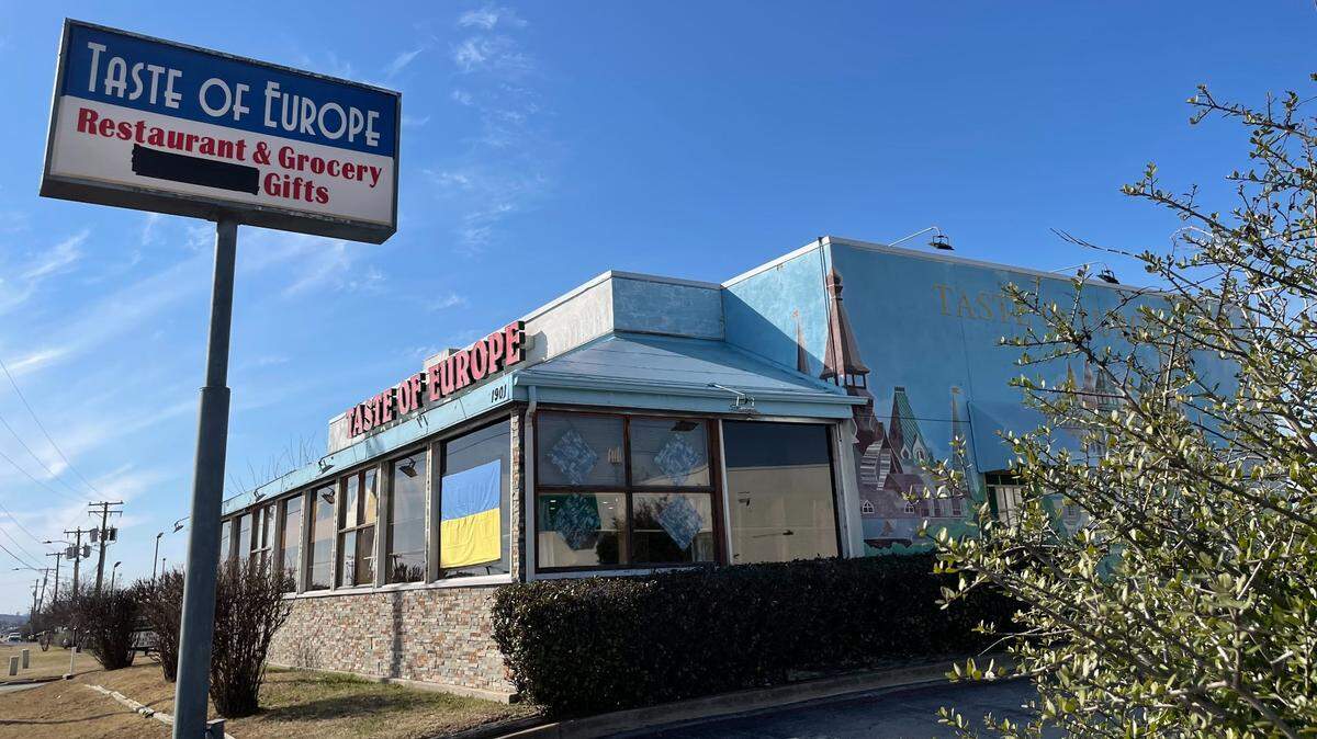 The Taste of Europe Restaurant, which has been in Arlington since 2002, blacked out Russia from its sign and hung a Ukrainian flag in its front window in solidarity.