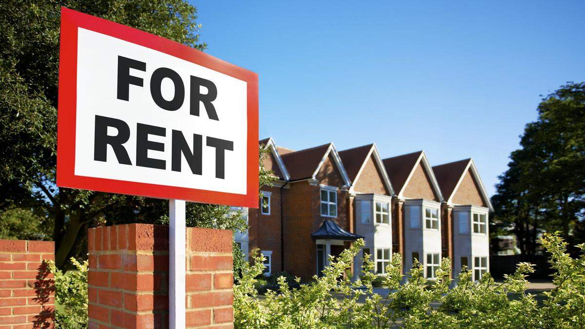 A sign shows that apartments are for rent.