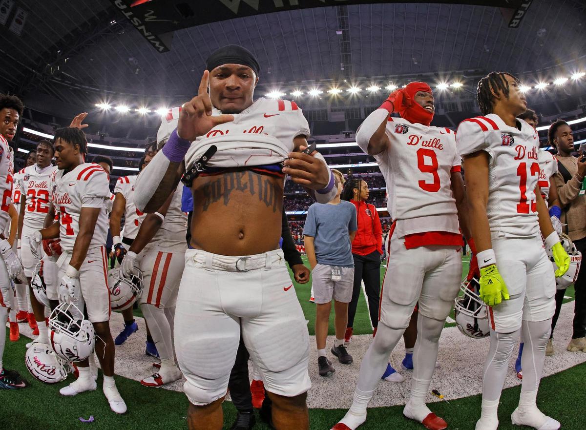 Duncanville running back Caden Durham (29) shows his Superior tattoo and poses for the camera after the UIL Conference 6A Division 1 state championship football game at AT&T Stadium in Arlington, Texas, Saturday, Dec. 16, 2023.