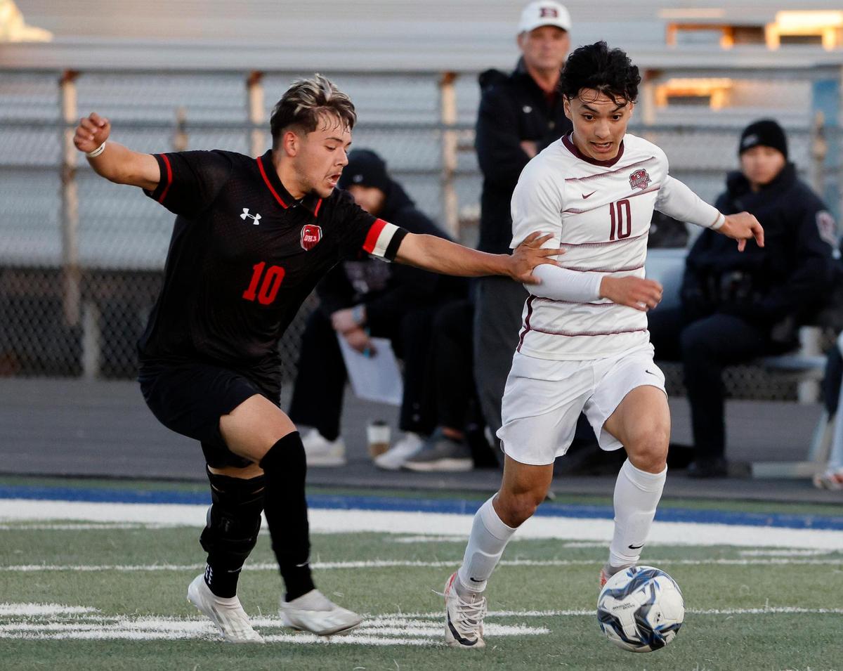 Diamond Hill-Jarvis’ Edgar Resendiz battles Bridgeport’s Daniel Aguilar for the ball during a UIL Class 4A Regional Quarterfinal soccer game at Kangaroo Stadium in Weatherford Texas, Tuesday Apr 02, 2024. Diamond Hill led 2-0 at the half.