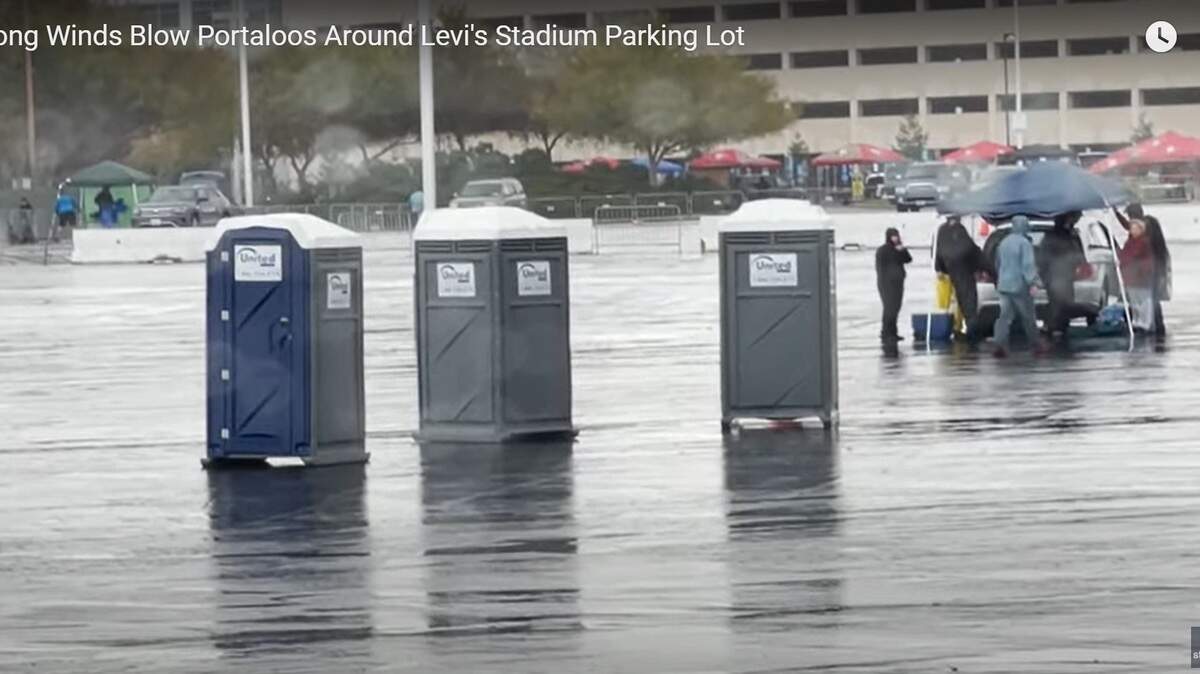Porta potties on the move in the parking lot of Levi Stadium.