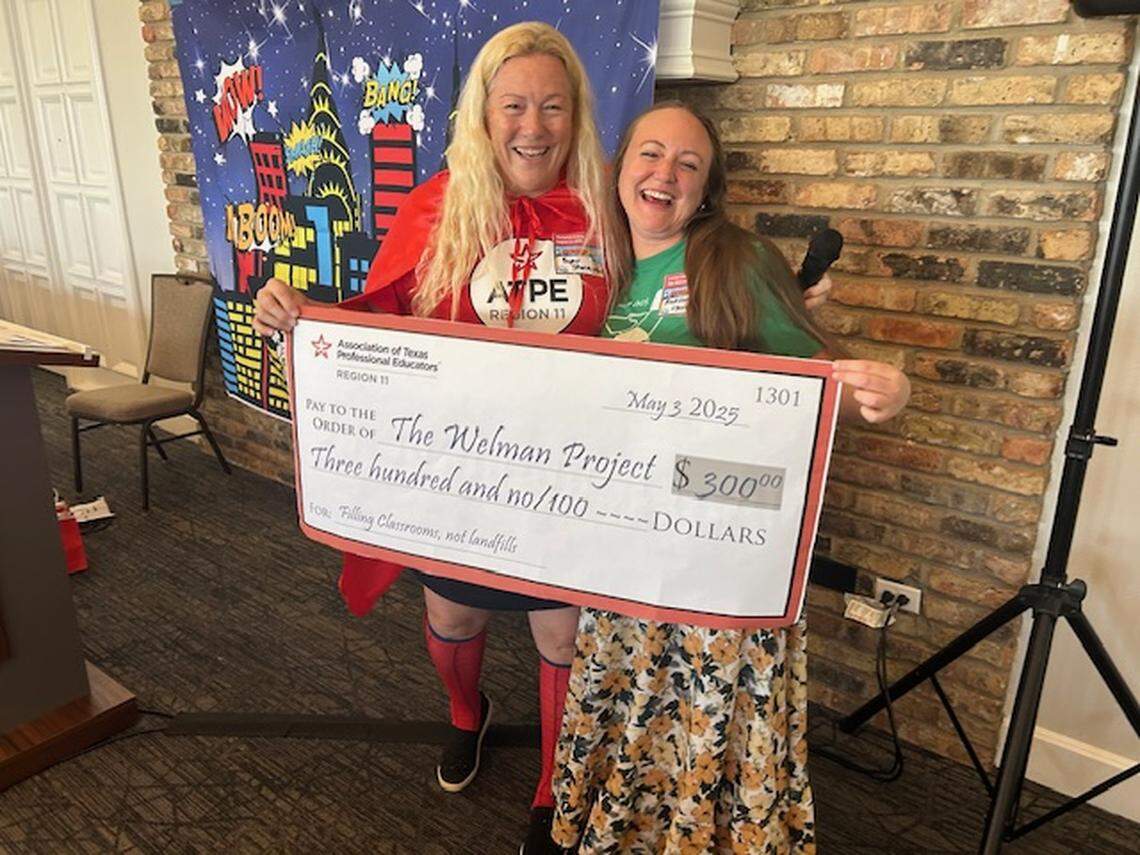 Marianne Eckley (left), past president of the Association of Texas Professional Educators’ Region 11 chapter, poses with Lauren Watson (right), development and marketing director of the Welman Project. The teachers association donates $300 annually to the Welman Project to support its mission of serving teachers and community members.