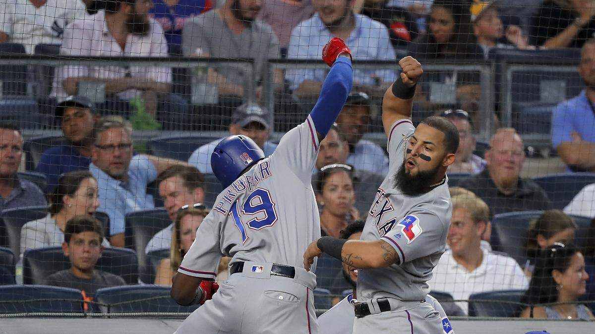 Jurickson Profar (19) celebrates his home run with Rougned Odor in the fourth inning Thursday against the New York Yankees.