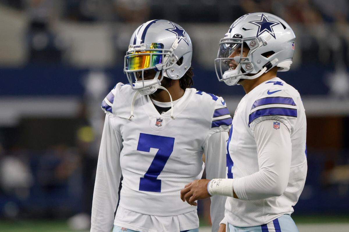 Dallas Cowboys cornerback Trevon Diggs (7) and quarterback Dak Prescott, right talk before Friday’s presason game.