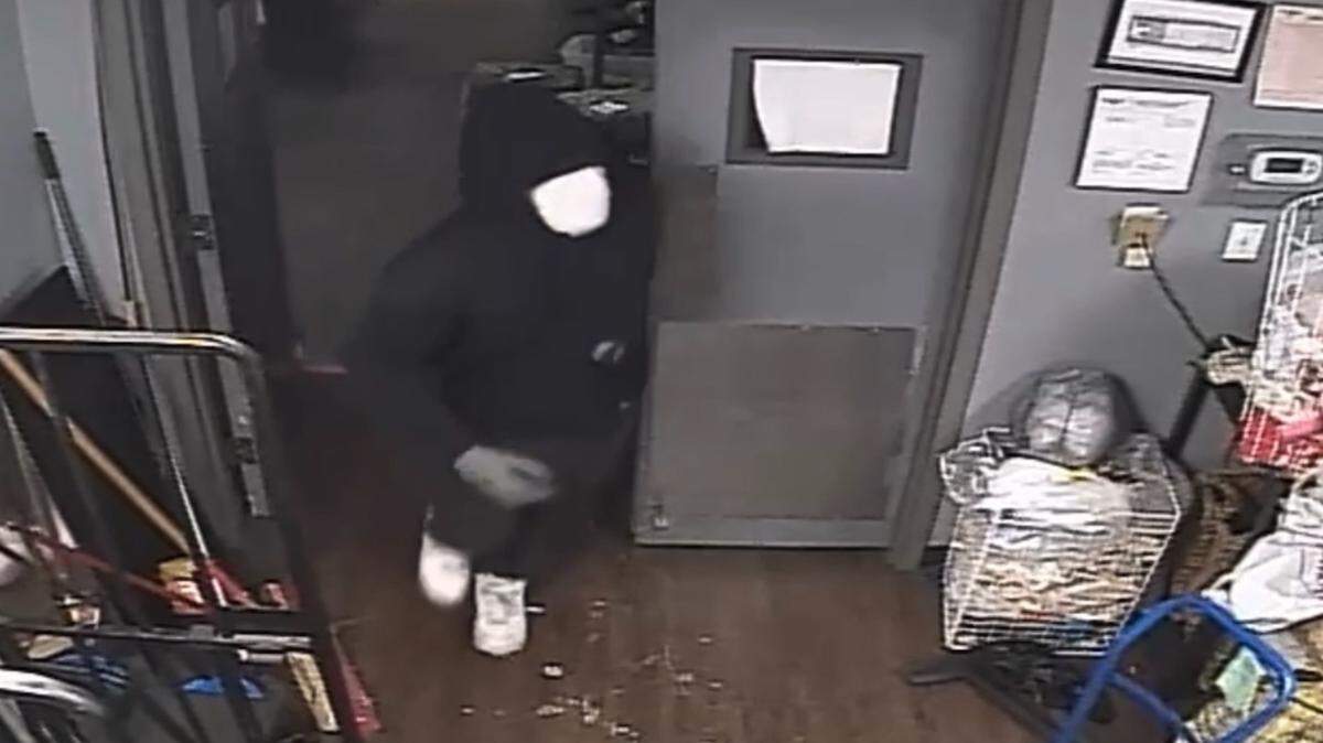 A burglar wearing a mask and gloves stole money from Berry Good Buys Resale Store in Fort Worth on Sunday, Nov. 28, 2021.