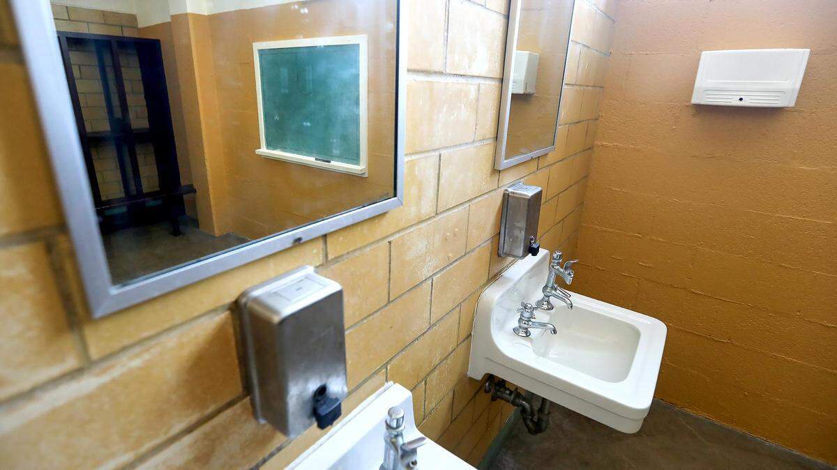 The design of traditional school restrooms and locker rooms like the one seen here is being modified to allow for all genders in states that allow bathroom choice.
