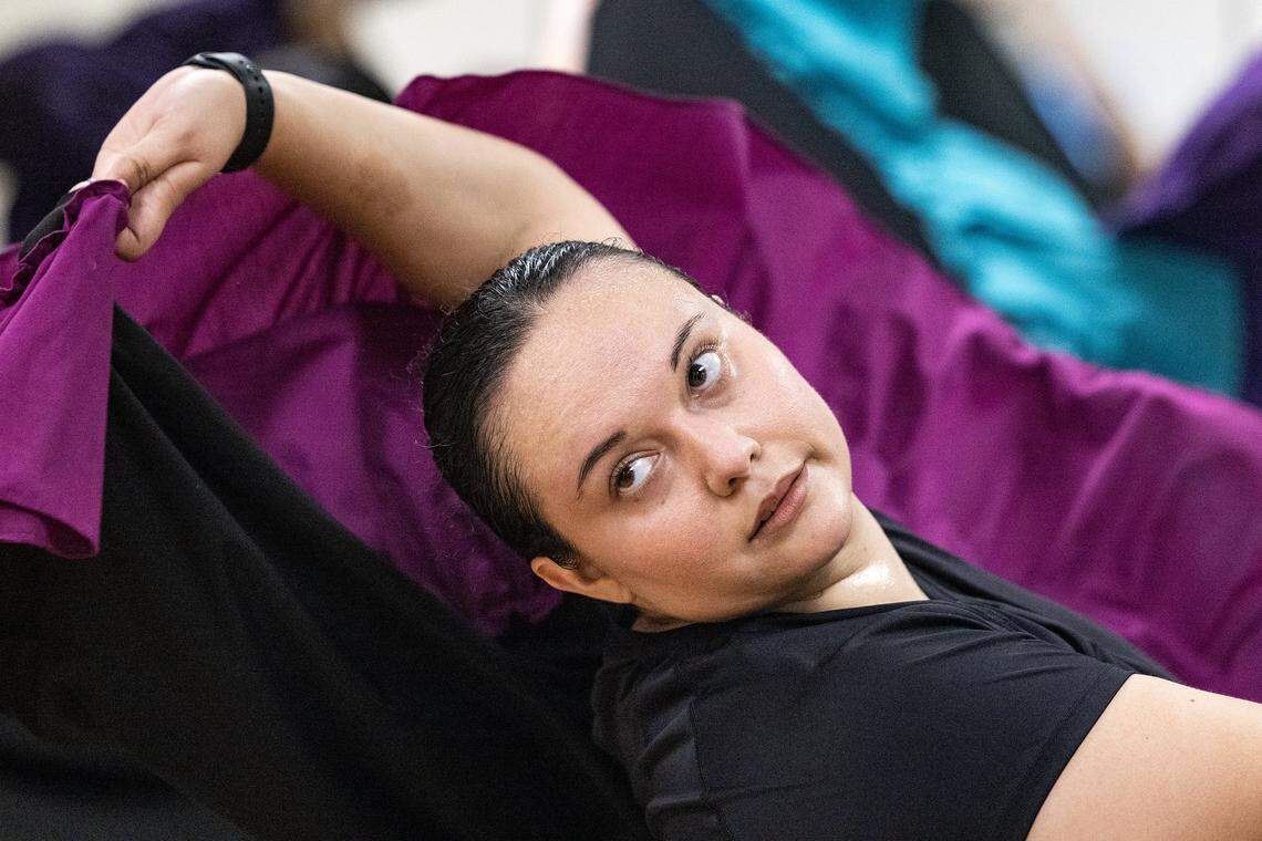 A closeup of Kassaandra Ibañez lifting her skirt while dancing.