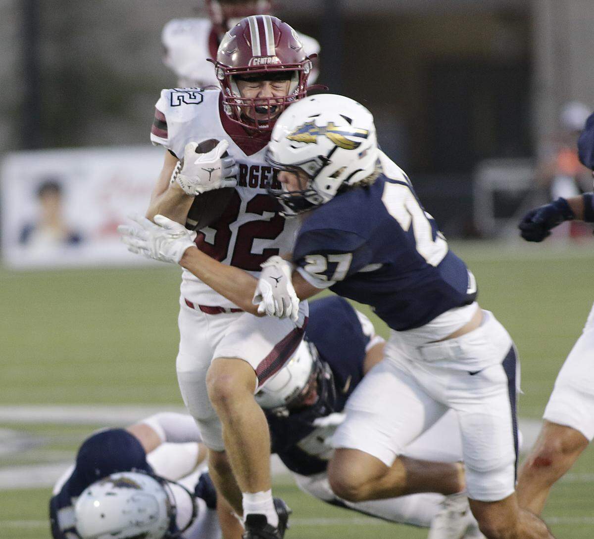 Keller Central’s Spencer Martin (23) is hit going down field against Keller during their game at Keller ISD Athletic Complex on Friday, Sep. 26, 2025.