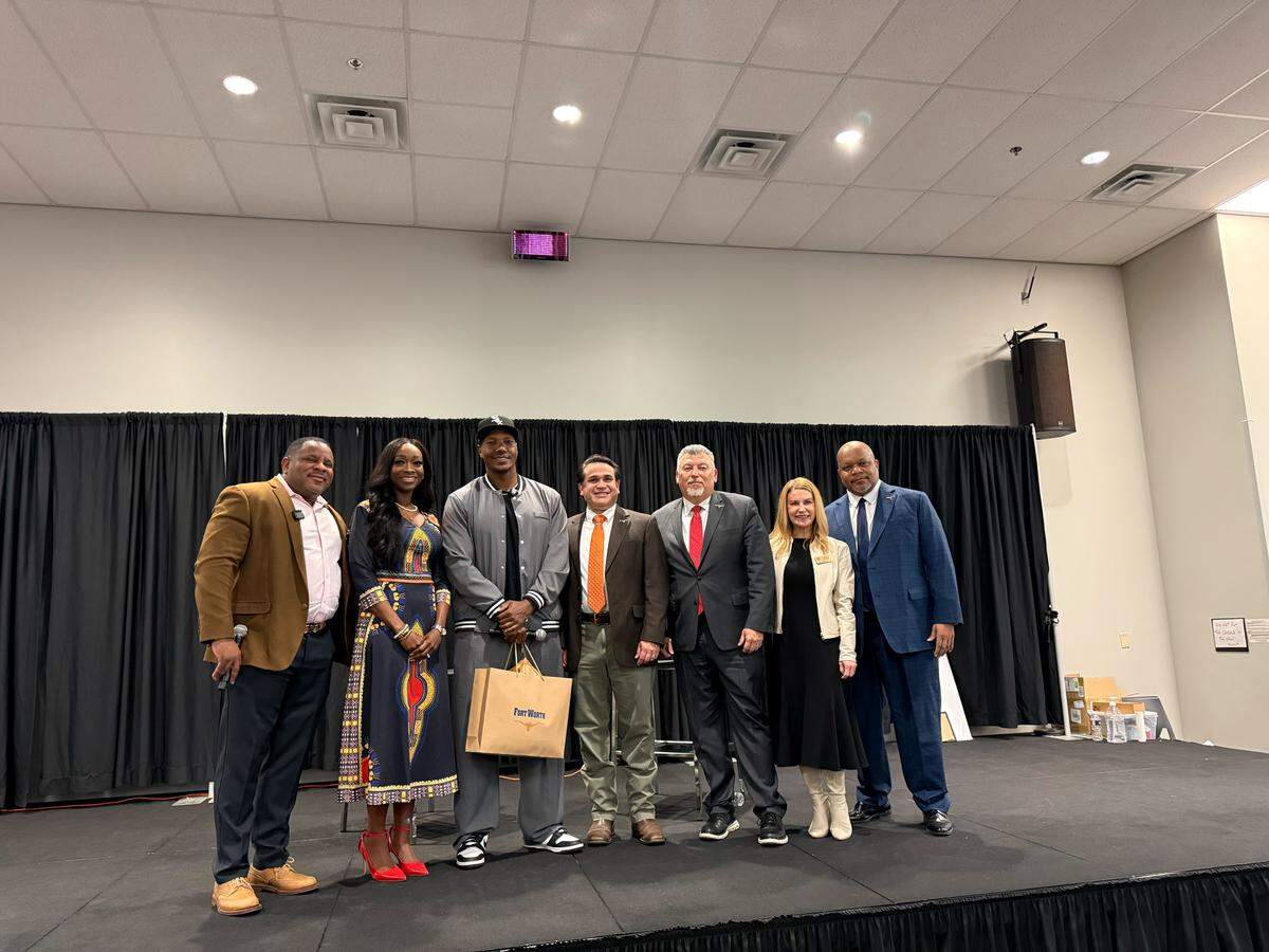 City Council members greeted Isaac Keys and presented him with a gift on behalf of Mayor Mattie Parker.