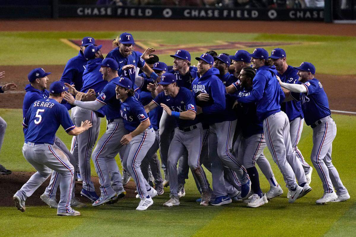 Texas Rangers celebrate after winning Game 5 of the baseball World Series against the Arizona Diamondbacks Wednesday, Nov. 1, 2023, in Phoenix. The Rangers won 5-0 to win the series 4-1.