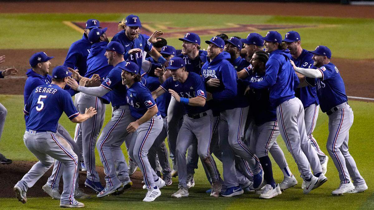 Texas Rangers celebrate after winning Game 5 of the baseball World Series against the Arizona Diamondbacks Wednesday, Nov. 1, 2023, in Phoenix. The Rangers won 5-0 to win the series 4-1.