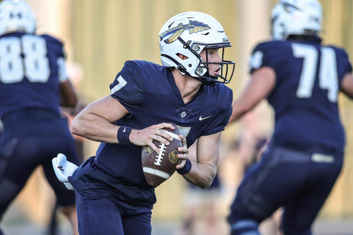 Keller High School quarterback Kaden Olson rolls out against the Northwest defense in Friday’s District 4-6A game at Keller ISD Stadium. Tom Marvin / Special to the Star-Telegram