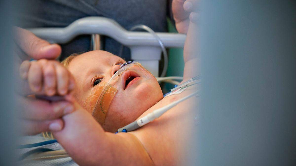 Rohen Carberry, 16-months, plays in his crib at the University of Iowa Stead Family Children’s Hospital in this 2021 file photo. Carberry, who was born with Down Syndrome, was hospitalized for RSV.