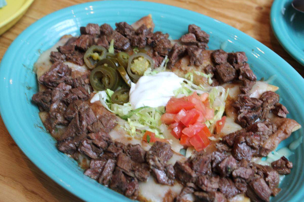 Steak fajita nachos are apart of the El Tiempo Cantina, the skirt steak being more tender from its almost month long aging process.
