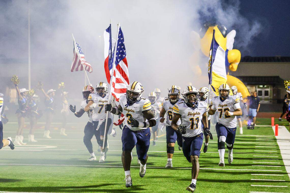 The Arlington Heights team takes the field on Thursday, October 10, 2025, at Rough Rider Stadium in Saginaw, Texas.