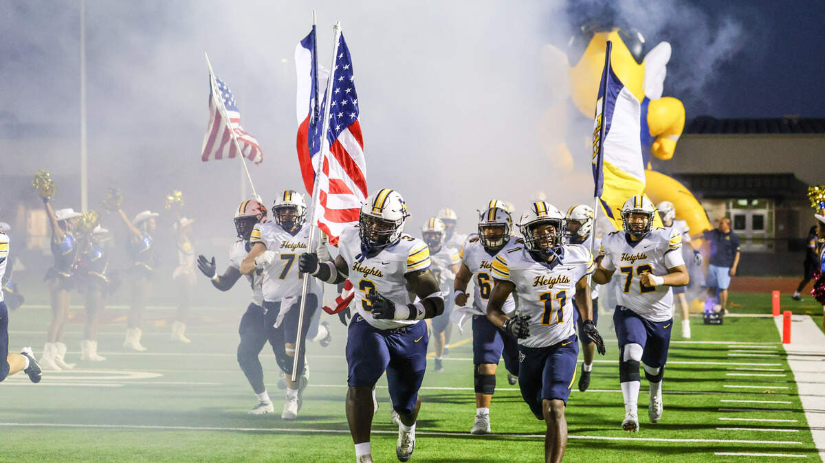 The Arlington Heights team takes the field on Thursday, October 10, 2025, at Rough Rider Stadium in Saginaw, Texas.