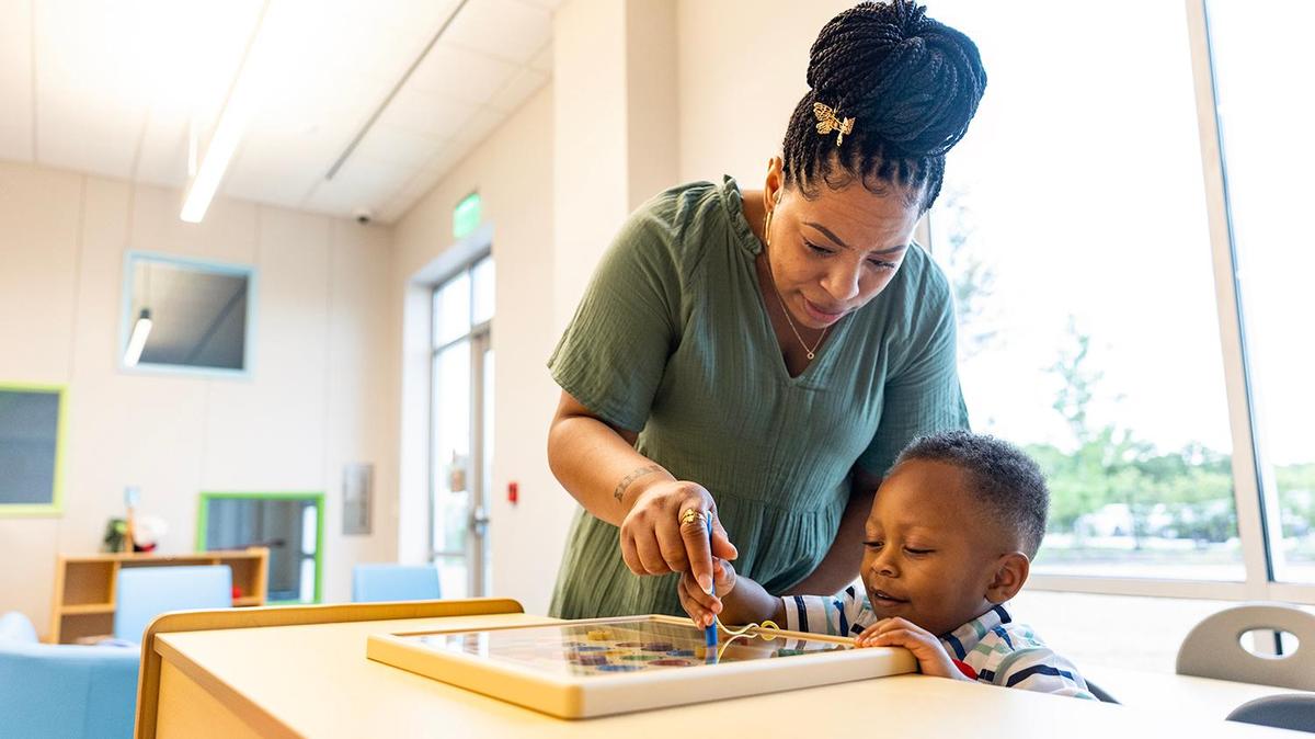 Tanisha Thomas plays with her son Kingston, 3, in one of the child care rooms following the grand opening ceremony of the new Riverside Campus of the Center for Transforming Lives in the Morningside neighborhood of Fort Worth on Friday, May 2, 2025. With the help of the organization, Thomas was able to find stability after experiencing homelessness and battling suicidal thoughts.