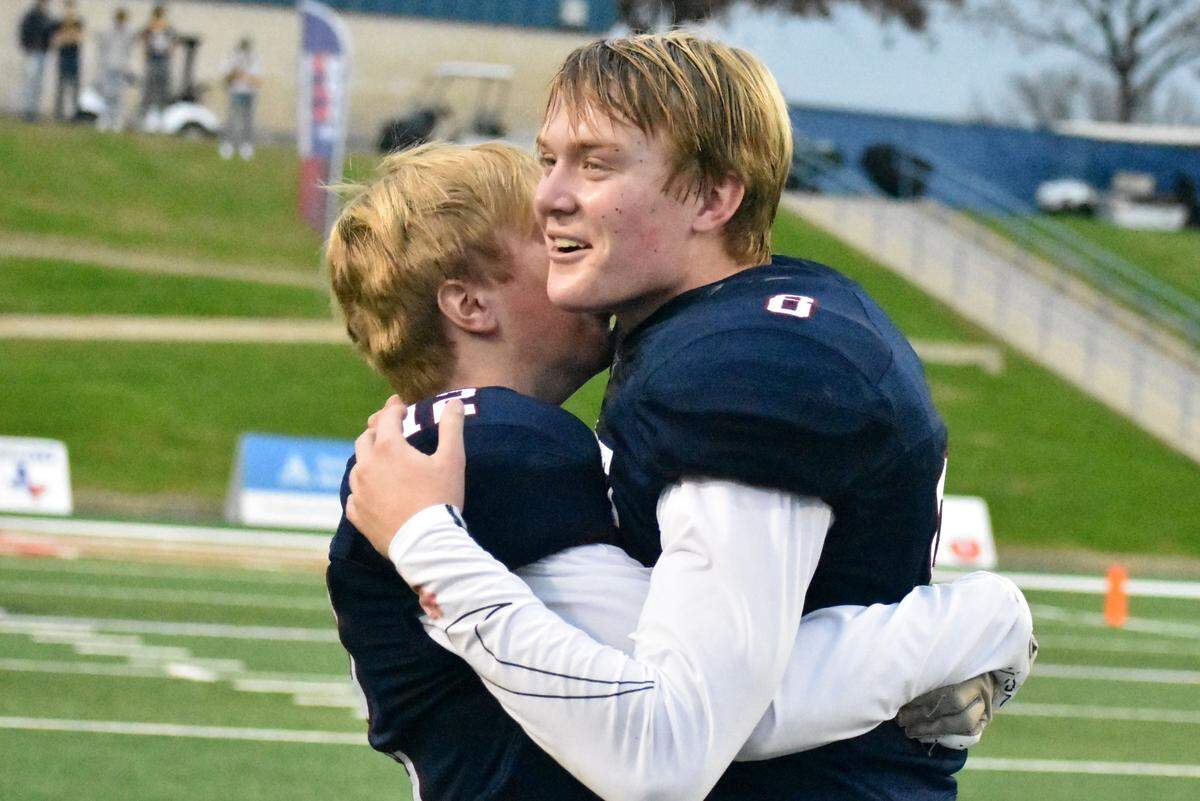 Covenant Classical quarterback Lanham Briley shares an embrace with younger brother Cole Briley after the Cavaliers defeated Pasadena First Baptist 68-30 on Thursday, December 1, 2022 at Waco ISD Stadium. Courtesy Antony Blalock/txhsfb.net