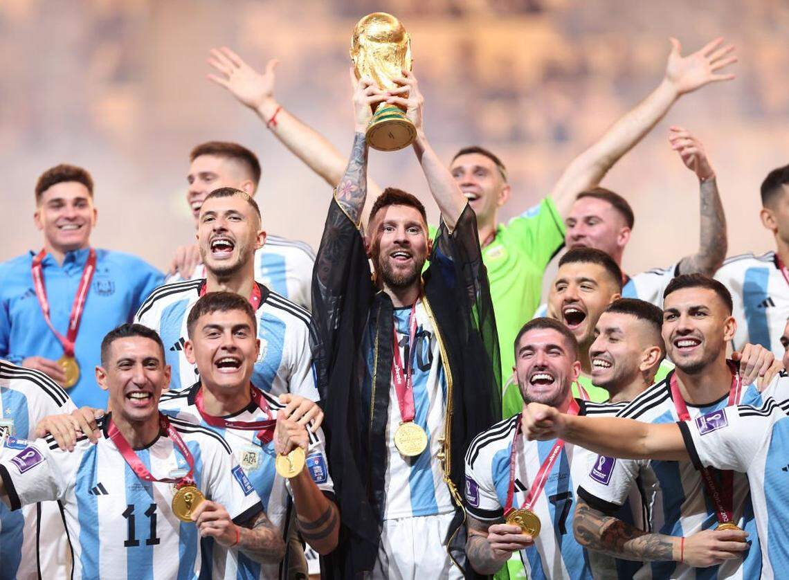 LUSAIL CITY, QATAR - DECEMBER 18: Lionel Messi of Argentina lifts the FIFA World Cup Qatar 2022 Winner's Trophy during the FIFA World Cup Qatar 2022 Final match between Argentina and France at Lusail Stadium on December 18, 2022 in Lusail City, Qatar. (Photo by Julian Finney/Getty Images)