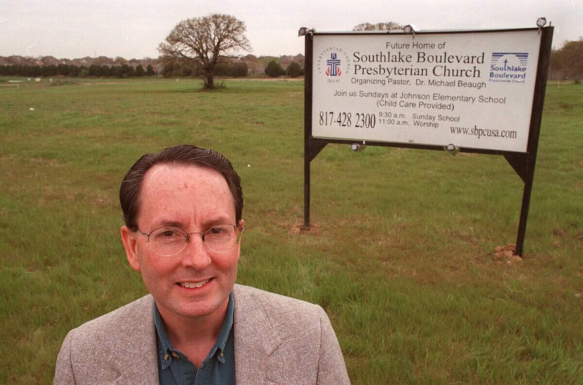 March 17, 1999: The Rev. Michael Beaugh stands in front of the empty lot that will be the site of the new Southlake Boulevard Presbyterian Church along Souhtlake Boulevard.
