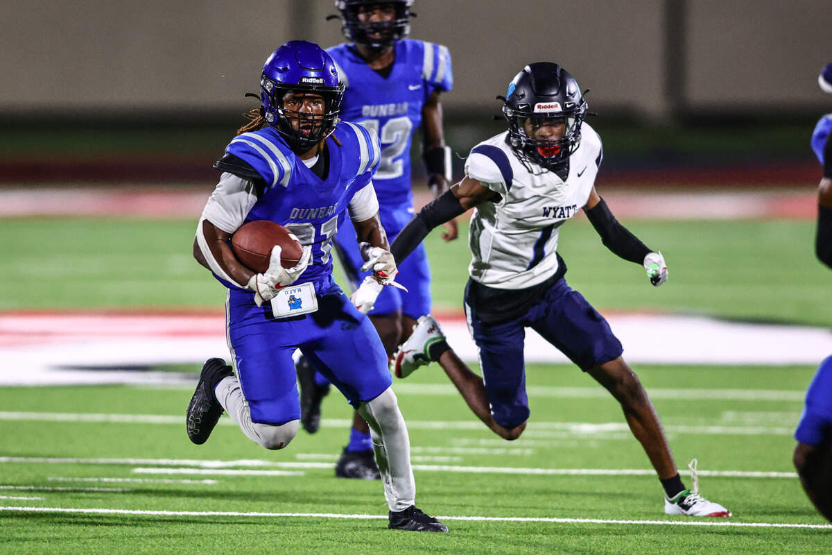 Dunbar running back JaMarion Garrett looks for yardage against Wyatt on Thursday, September 5, 2024 at Clark Stadium in Fort Worth, Texas. Dunbar rallied to defeat Wyatt 14-13.