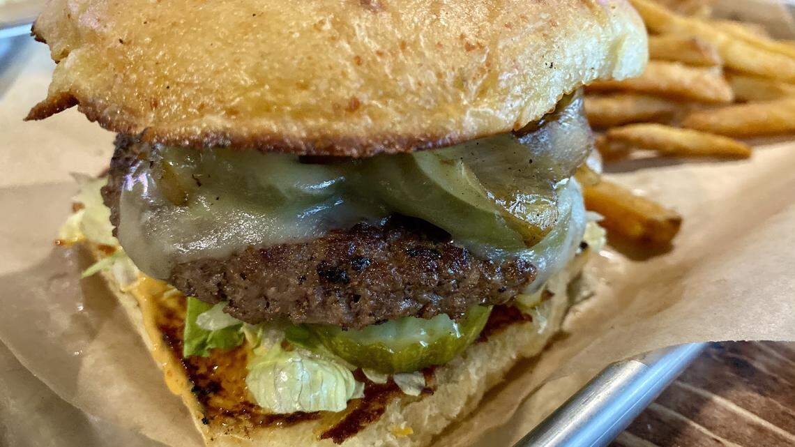 The Lakefire jalapeno burger has pepper Jack cheese, peppers, caramelized onions and chipotle mayo on a jalapeno bun.