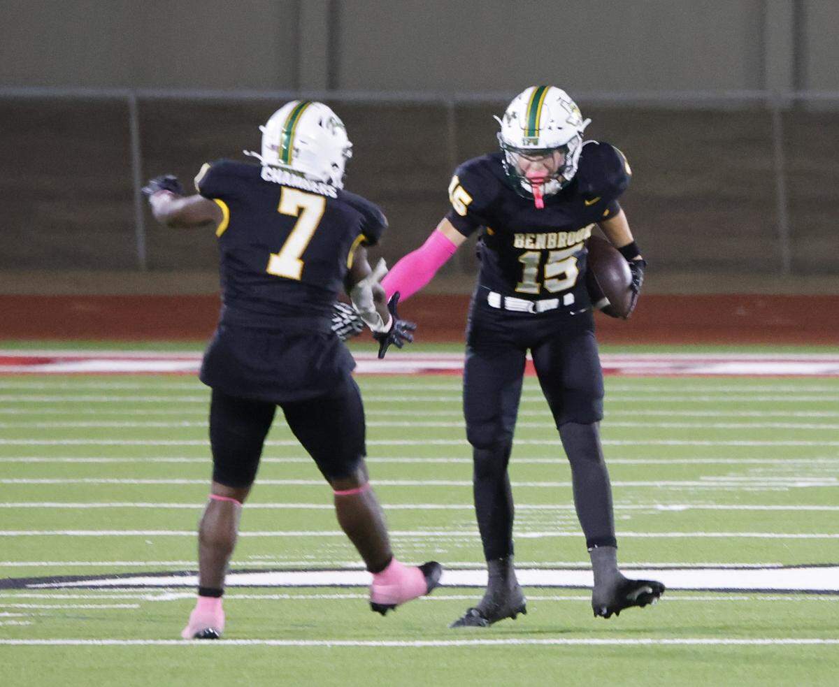 Benbrook linebacker Desmond Chambers (7) celebrates with defenisve back Seth James (15) after James recovered the game-ending Dunbar fumble during the second half of a UIL football game between Benbrook and Dunbar at Herman E. Clark Stadium in Fort Worth, Texas, Friday, October 10, 2025.