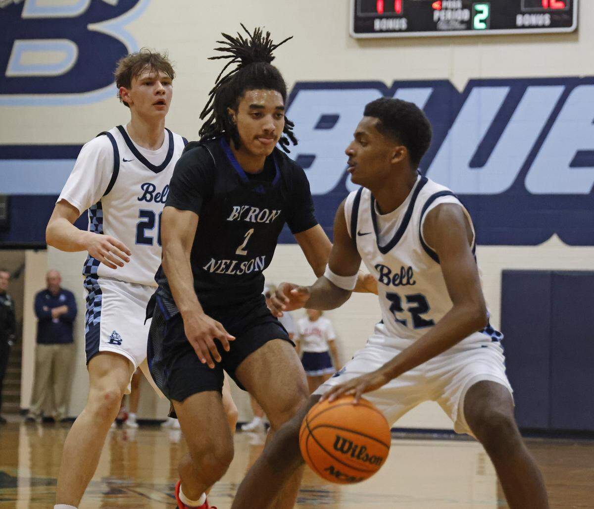 L.D. Bell guard Keyaun Williams (22) attempts to get away from Byron Nelson guard Alex Jackson (2) during the first half of a boys UIL basketball game between Byron Nelson and L.D. Bell at L.D. Bell High School in Hurst, Texas, Friday Feb. 06, 2026