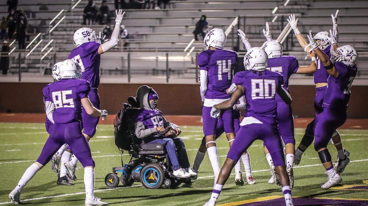 Saginaw Chisholm Trail Xavier Hernandez, who has muscular dystrophy, scores a touchdown against Weatherford on the Rangers’ senior night on Dec. 4.