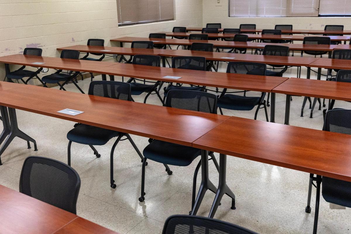 Long tables and chairs sit in a classroom in the Tarrant County Sheriff's Training Academy.