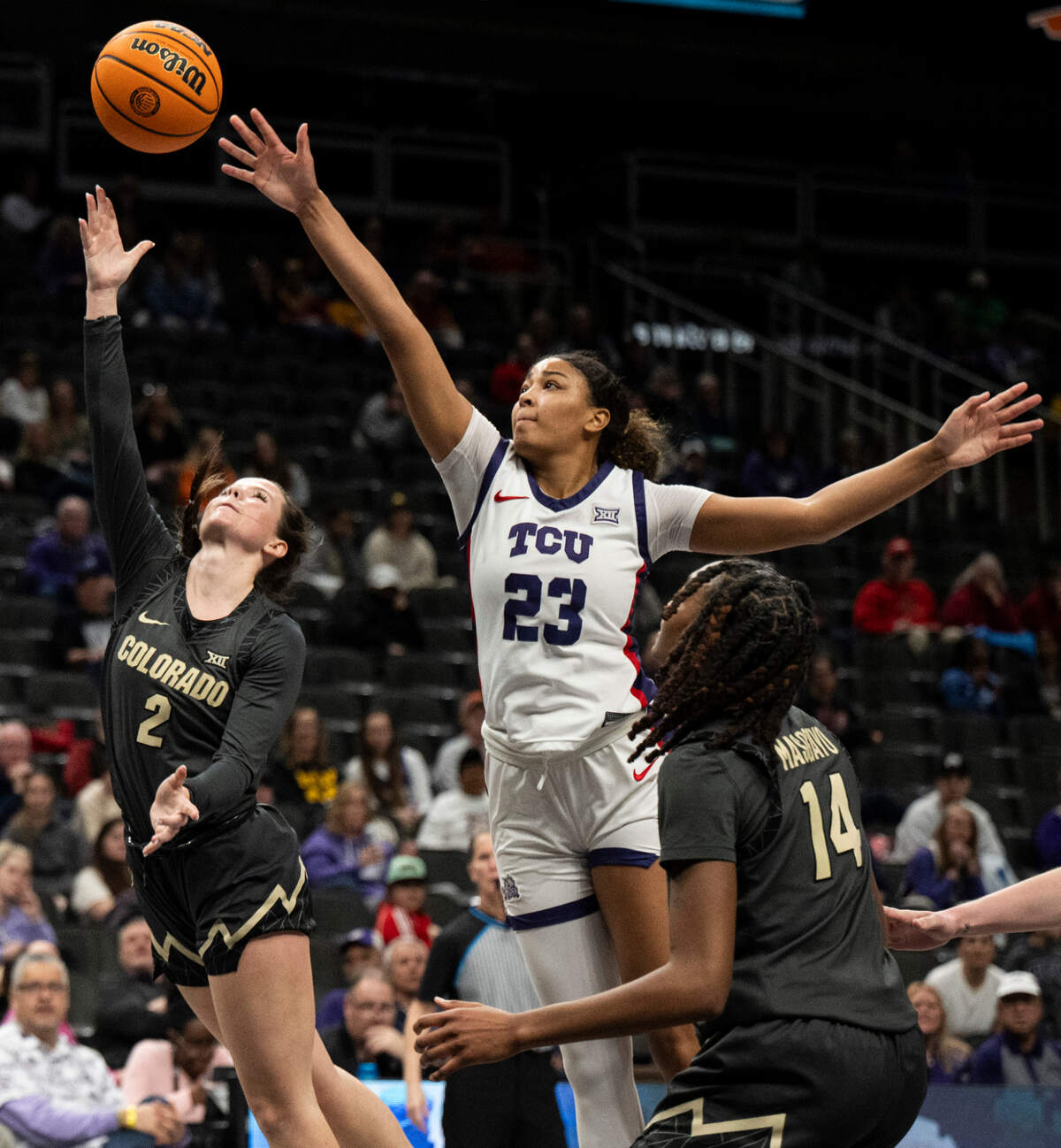 Colorado Buffaloes guard Kennedy Sanders (2) shoots the ball while defended by TCU Horned Frogs forward Aaliyah Roberson (23) during the fourth quarter at T-Mobile Center on March 7, 202, in Kansas City, MO.