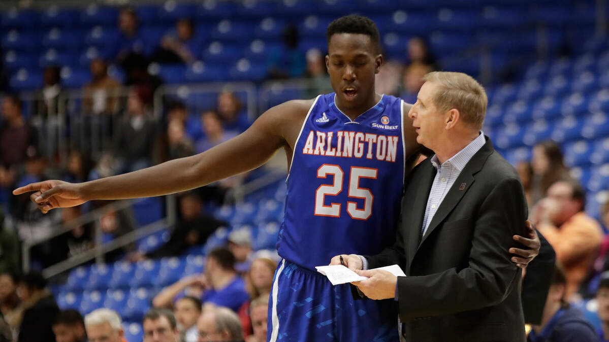 Greg Young, right, has moved up to the head coaching position for UTA basketball after serving in the program for 12 years.