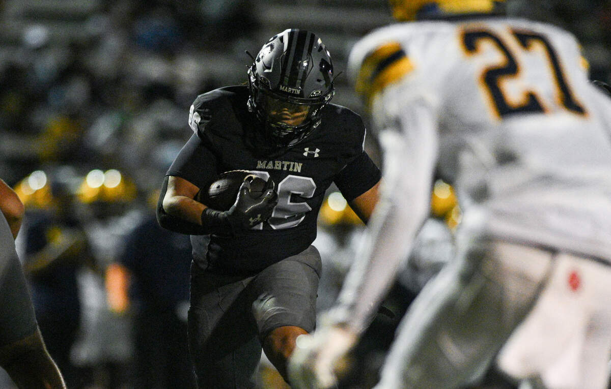 Martin High School running back Lamar Gordon (26) runs towards defenders during a UIL football game against Lamar High School at Cravens Field in Arlington, Texas on Friday, Sept. 20, 2024.