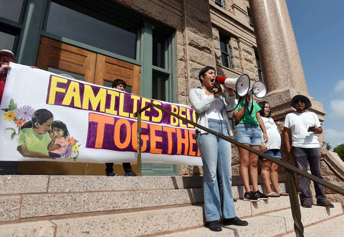 Linda Vazquez, leads demostrators in a chant on the steps of the Tarrant County Courthouse before a march to the Federal Building in downtown Fort Worth, Texas as part of the worldwide Families Belong Together March and Rally on  Saturday June 30, 2018.  The march is to highlight the unfairness of current U.S. immigration policies. Special/Bob Haynes