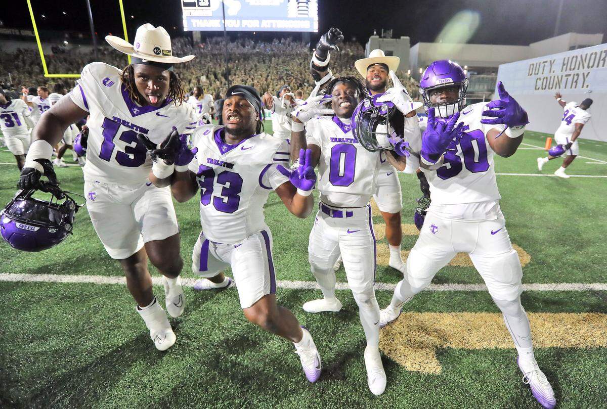 Aug 29, 2025; West Point, New York, USA; Tarleton State Texans wide receiver Peyton Kramer (13) and defensive lineman Jay Henry (33) celebrate with running back Tre Page III (0) and linebacker Markell Johnson (30) after a double overtime win against the Army Black Knights at Michie Stadium. Mandatory Credit: Danny Wild-Imagn Images