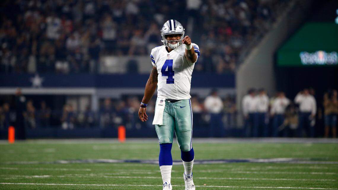 Dallas Cowboys quarterback Dak Prescott (4) celebrates after throwing a pass to Dallas Cowboys’ Cole Beasley in the first half of an NFL football game against the Chicago Bears on Sunday, Sept. 25, 2016, in Arlington, Texas. (AP Photo/Ron Jenkins)