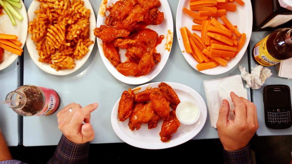 Chicken wings and sides at Atomic Wings in Midtown Manhattan. The restaurant is opening in Arlington.