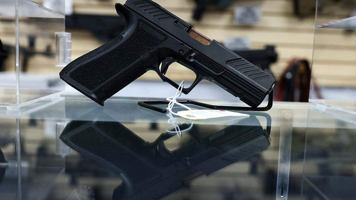 A shadow system pistol is displayed for sale in a gun store in Rio Rico, Santa Cruz County, Arizona on September 17, 2025. Arizona allows individuals legally eligible to own guns to carry them without a permit, background checks apply to dealer sales but not most private transactions. (Photo by CHARLY TRIBALLEAU / AFP) (Photo by CHARLY TRIBALLEAU/AFP via Getty Images)          